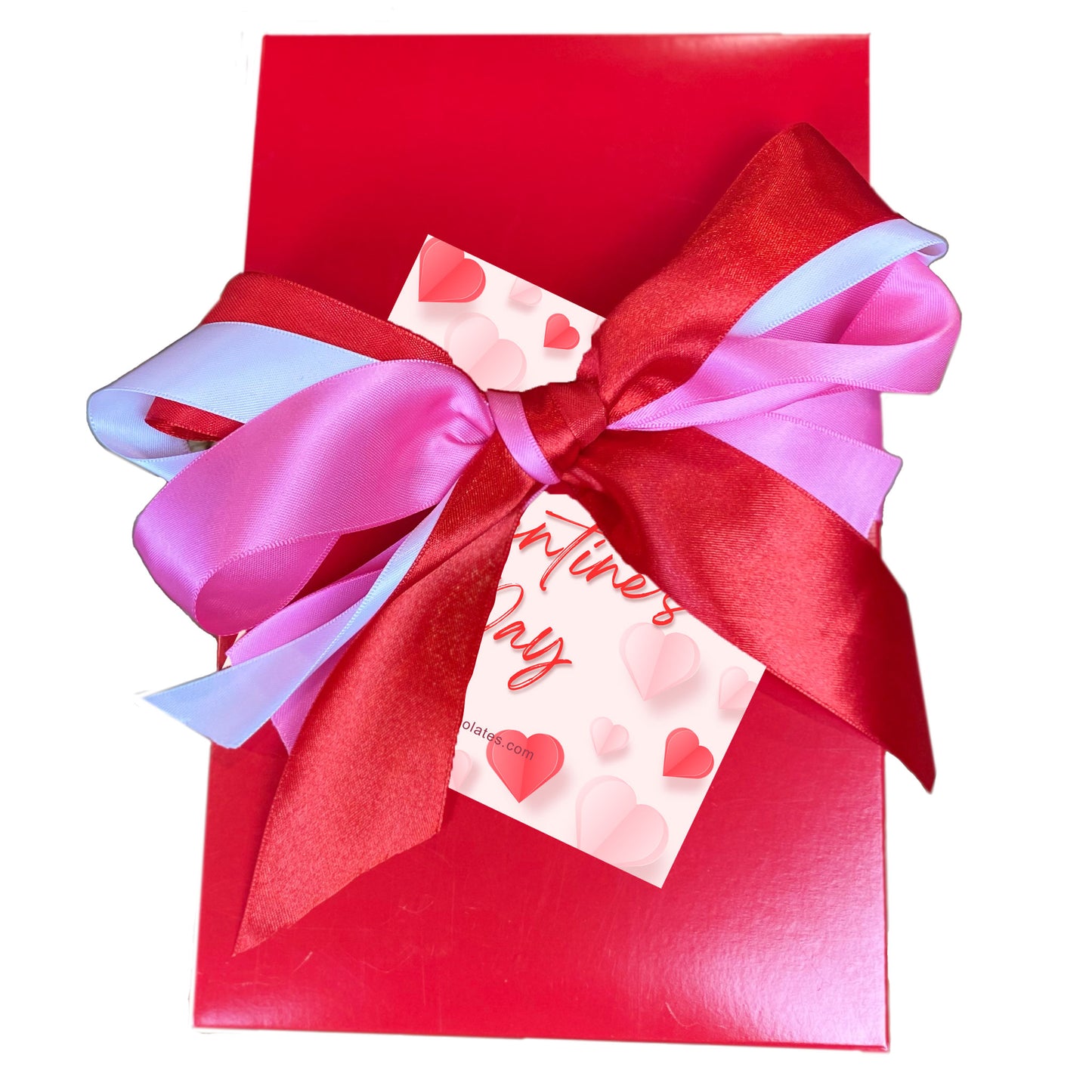 A bright red rectangular gift box with colorful pink red and white ribbon gift wrap. Featuring a Valentine themed gift card featuring red and pink heart with the inscription happy valentine's day