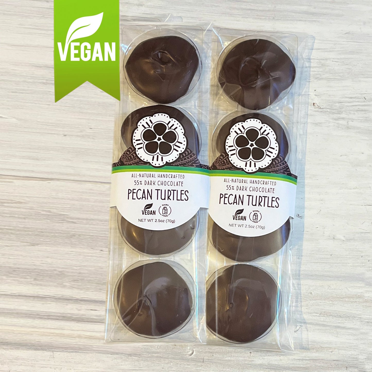 Two packages of NOCO Chocolates 4-piece vegan and dairy-free pecan turtle patties